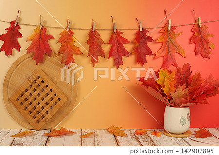 Creative autumn composition and banner for display. Empty modern elegant product display table with maple leaves on kitchen background, minimalist autumn concept. Happy Thanksgiving greeting card. 142907895