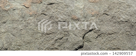 Gray rough rock surface creating natural background 142909557