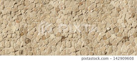 Stone wall surface creating a rustic texture background Stone wall surface creating a rustic texture background 142909608