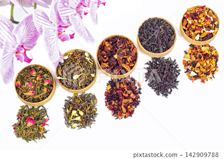 different types of tea on a white background. a kind of delicious fruit tea. different types of tea on a white background. a kind of delicious fruit tea. 142909788