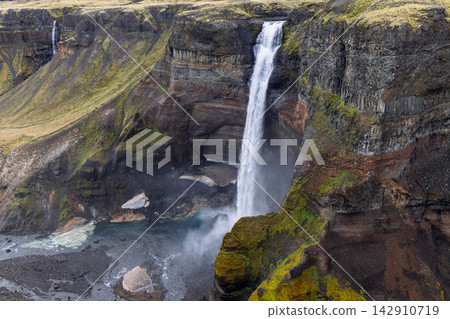 Haifoss waterfall above a rocky canyon pool below cliffs in Thjorsardalur, Iceland Haifoss waterfall above a rocky canyon pool below cliffs in Thjorsardalur, Iceland 142910719
