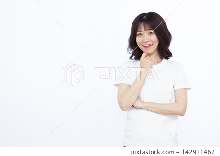 Woman thinking with a smile Woman thinking with a smile 142911462