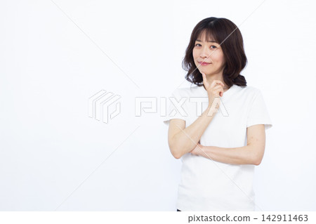 Woman thinking with a smile Woman thinking with a smile 142911463