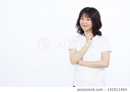 Woman thinking with a smile Woman thinking with a smile 142911464