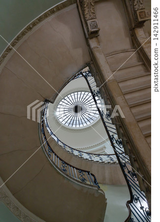 the Nelson Staircase within Somerset House in London, a grand spiral staircase inside a neoclassical building, the Nelson Staircase within Somerset House in London, a grand spiral staircase inside a neoclassical building, 142911466