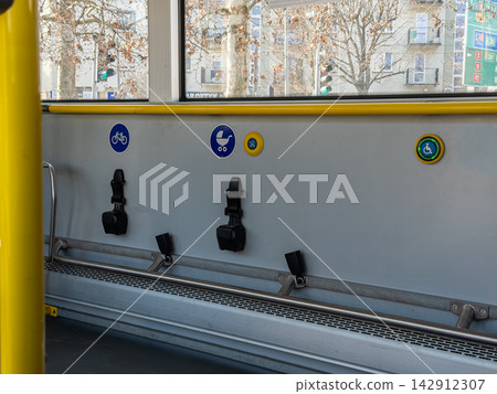 Designated area for bicycles, strollers, and wheelchair users inside a city bus, providing accessible transit infrastructure for inclusive public transportation and urban daily travel Designated area for bicycles, strollers, and wheelchair users inside a city bus, providing accessible transit infrastructure for inclusive public transportation and urban daily travel 142912307