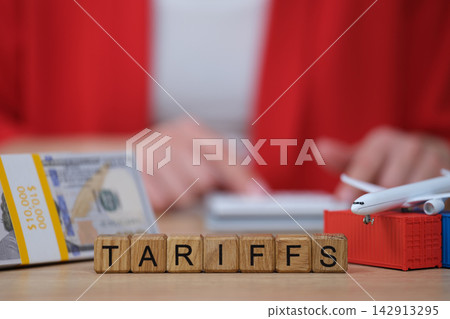 Understanding tariffs in global trade while handling money and models of airplanes 142913295
