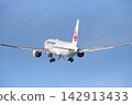 A JAL Boeing 767 passenger plane is retracting its landing gear as it takes off from Izumo Enmusubi Airport bound for Haneda: Izumo City, Shimane Prefecture (sunny) 142913433