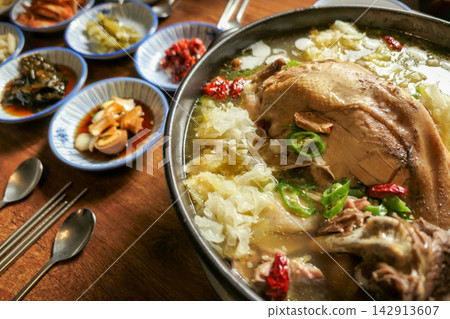 Korean Herbal Whole Duck Soup with Tremella Mushroom and Chili Peppers Korean Herbal Whole Duck Soup with Tremella Mushroom and Chili Peppers 142913607