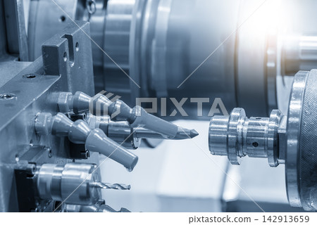 High precision parts mass production process by a multi-tasking CNC lathe machine with a blue lighting effect High precision parts mass production process by a multi-tasking CNC lathe machine with a blue lighting effect 142913659