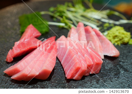 Assorted Fresh Raw Tuna Sashimi Platter with Wasabi and Sprouts Assorted Fresh Raw Tuna Sashimi Platter with Wasabi and Sprouts 142913670