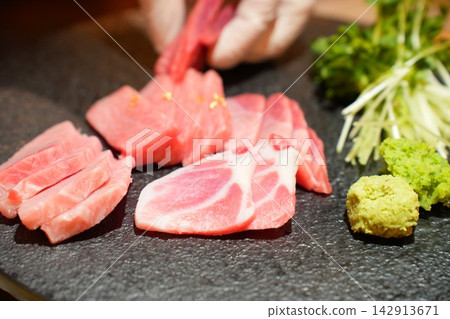 Assorted Fresh Raw Tuna Sashimi Platter with Wasabi and Sprouts Assorted Fresh Raw Tuna Sashimi Platter with Wasabi and Sprouts 142913671
