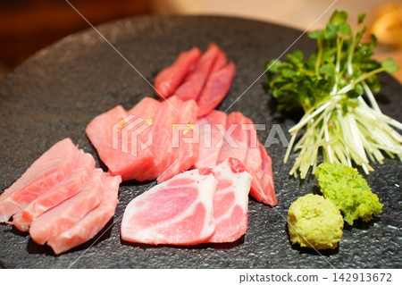 Assorted Fresh Raw Tuna Sashimi Platter with Wasabi and Sprouts Assorted Fresh Raw Tuna Sashimi Platter with Wasabi and Sprouts 142913672