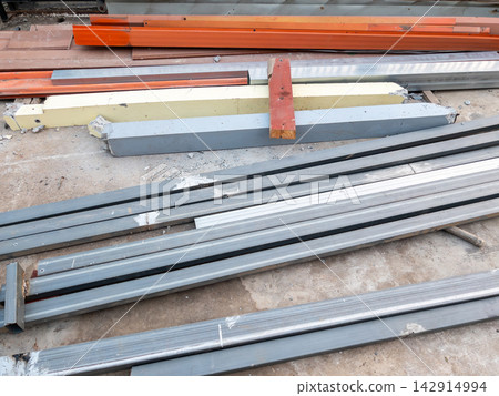 Stacked Metal Beams at Construction Site Stacked Metal Beams at Construction Site 142914994