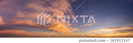 Amazing sunset skyscape. Evening sky with bright colorful orange and yellow clouds Amazing sunset skyscape. Evening sky with bright colorful orange and yellow clouds 142915147