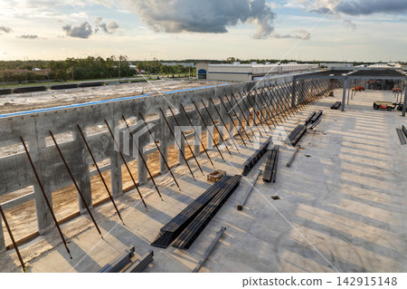 Development of commercial real estate in USA. Construction works on monolithic frame at large building site of logistics distribution warehouse 142915148