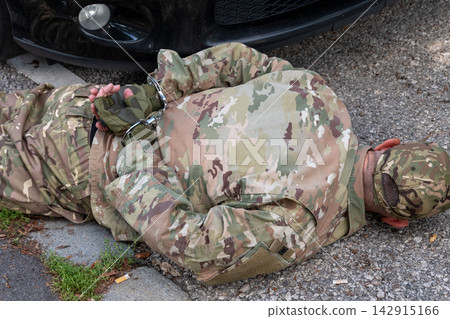Conceptual scene of military police and counterintelligence services detaining a person suspected of espionage. Conceptual scene of military police and counterintelligence services detaining a person suspected of espionage. 142915166