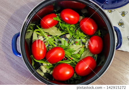 Homemade pickled tomatoes preparation for autumn preserving, canning and seasonal pantry Homemade pickled tomatoes preparation for autumn preserving, canning and seasonal pantry 142915272
