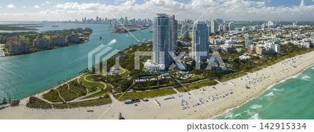 Popular vacation spot in the United States. Ocean warm waters and sandy beachfront at Miami Beach in Florida, USA. American travel destination 142915334