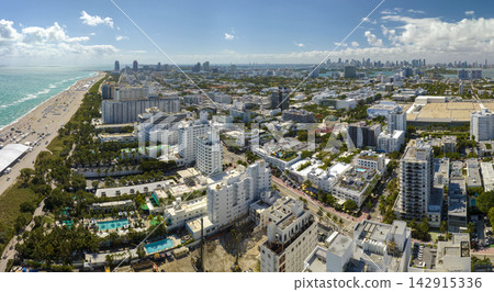 American southern architecture of Miami Beach. South Beach high luxurious hotels and apartment buildings. Tourist infrastructure in southern Florida, USA American southern architecture of Miami Beach. South Beach high luxurious hotels and apartment buildings. Tourist infrastructure in southern Florida, USA 142915336