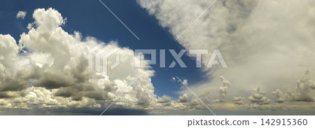 Blue sky with white summer rain clouds. Colorful summer landscape Blue sky with white summer rain clouds. Colorful summer landscape 142915360
