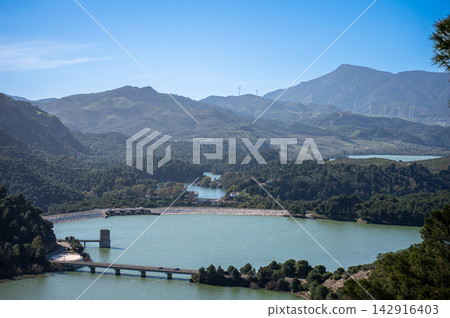 Scenic Guadalhorce reservoirs filled to the brim with water creating breathtaking natural landscape in Spain. Scenic Guadalhorce reservoirs filled to the brim with water creating breathtaking natural landscape in Spain. 142916403