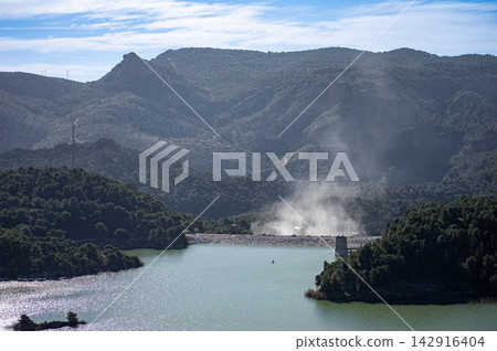 Scenic Guadalhorce reservoirs filled to the brim with water creating breathtaking natural landscape in Spain. Scenic Guadalhorce reservoirs filled to the brim with water creating breathtaking natural landscape in Spain. 142916404