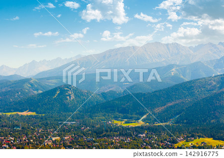 mountain landscape of Poland in late summertime. wonderful view of High Tatra ridge above Zakopane village valley. vacation place in Europe mountain landscape of Poland in late summertime. wonderful view of High Tatra ridge above Zakopane village valley. vacation place in Europe 142916775