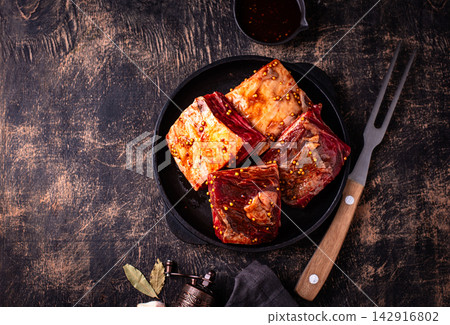 Raw uncooked lamb ribs for barbecue Raw uncooked lamb ribs for barbecue 142916802