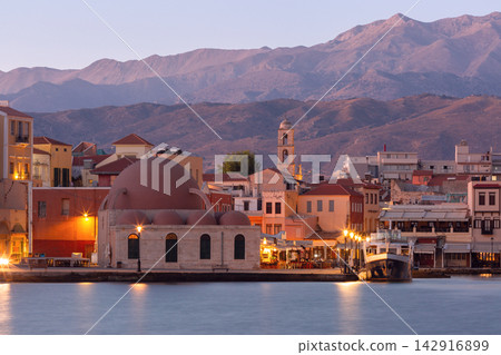 Chania Harbor Waterfront and Historic Buildings at Sunrise in Crete, Greece Chania Harbor Waterfront and Historic Buildings at Sunrise in Crete, Greece 142916899