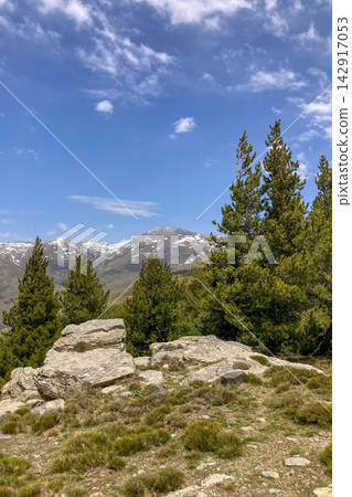 Hiking trail to Mulhacen peak in the spring in Sierra Nevada National Park, Spain Hiking trail to Mulhacen peak in the spring in Sierra Nevada National Park, Spain 142917053
