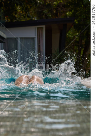 a girl with a beautiful tanned body having fun in the swimming pool of a luxury villa, the girl's butt is visible from under the water, azure water, splashes of water glow in the sun a girl with a beautiful tanned body having fun in the swimming pool of a luxury villa, the girl's butt is visible from under the water, azure water, splashes of water glow in the sun 142917766