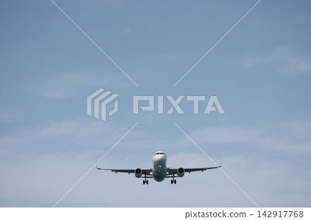 A huge passenger plane is landing in airport of Phuket, Thailand, a bottom view  142917768