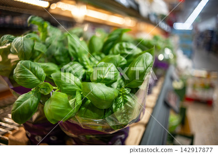 Fresh Basil Displayed in a Supermarket for Shoppers Fresh Basil Displayed in a Supermarket for Shoppers 142917877