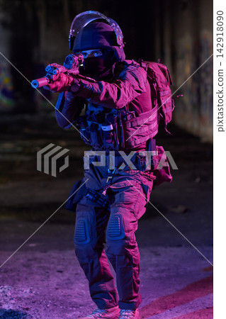 Tactical Soldier Aiming Rifle In Urban Night Environment With Neon Lighting And Protective Gear Tactical Soldier Aiming Rifle In Urban Night Environment With Neon Lighting And Protective Gear 142918090