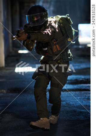 Tactical Soldier In Urban Combat Gear Aiming Assault Rifle Inside Dark Abandoned Building Tactical Soldier In Urban Combat Gear Aiming Assault Rifle Inside Dark Abandoned Building 142918128