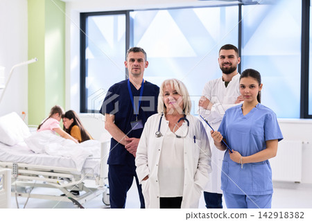 Medical team in a hospital setting working together to provide patient care and support in a bright, modern environment Medical team in a hospital setting working together to provide patient care and support in a bright, modern environment 142918382
