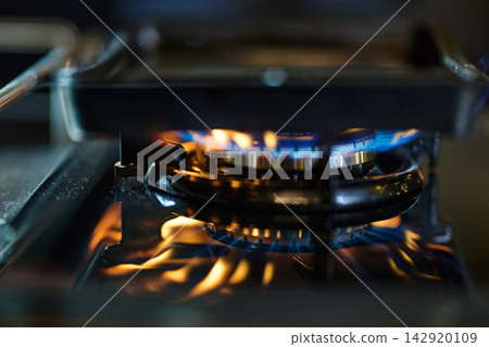 Gas Stove Burner With Blue Flame Close-Up Cooking Kitchen Heat And Energy Gas Stove Burner With Blue Flame Close-Up Cooking Kitchen Heat And Energy 142920109