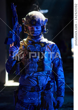 Tactical Soldier In Night Operation Gear Holding Rifle With Helmet And Ballistic Vest Tactical Soldier In Night Operation Gear Holding Rifle With Helmet And Ballistic Vest 142920392