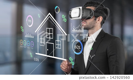 Businessman in Virtual Reality Glasses Analyzing Real Estate Data and Graphs for Innovative Technology Solutions and Market Insights. Entropy Businessman in Virtual Reality Glasses Analyzing Real Estate Data and Graphs for Innovative Technology Solutions and Market Insights. Entropy 142920560