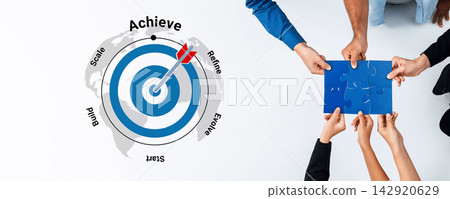 Collaborative Efforts in Business Strategy Development with Target Achievement Concept and Hands Holding Puzzle Piece on White Background Gantry Collaborative Efforts in Business Strategy Development with Target Achievement Concept and Hands Holding Puzzle Piece on White Background Gantry 142920629