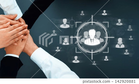A dynamic visual representation of teamwork, showcasing hands coming together above digital icons of people, symbolizing collaboration and professional unity in a modern work environment. Sigmoid 142920881