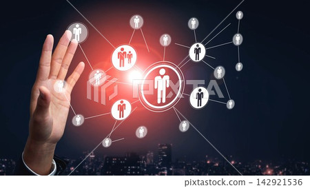 Digital connectivity illustration showing hand reaching out to various network nodes representing people in a modern urban setting at night Gluon Digital connectivity illustration showing hand reaching out to various network nodes representing people in a modern urban setting at night Gluon 142921536