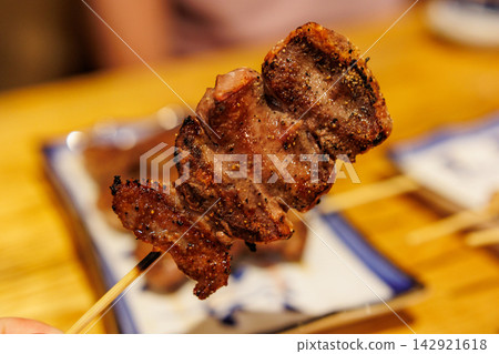 Grilled pork tongue skewers | Meat dishes at an izakaya (Japanese pub) Grilled pork tongue skewers | Meat dishes at an izakaya (Japanese pub) 142921618