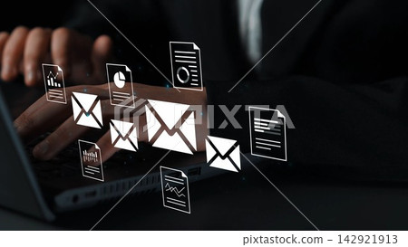 Hands Typing on Laptop with Digital Mail Icons and Business Documents in a Professional Environment Gluon 142921913
