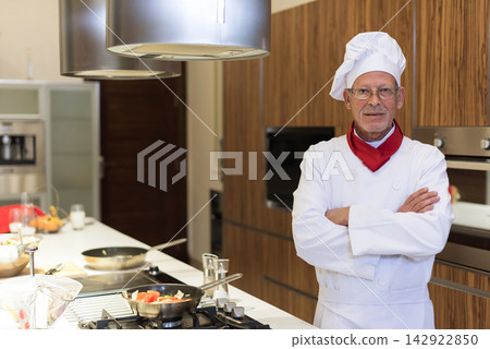 Middle Eastern chef preparing iftar dinner at modern home during Ramadan and Eid family celebration Middle Eastern chef preparing iftar dinner at modern home during Ramadan and Eid family celebration 142922850