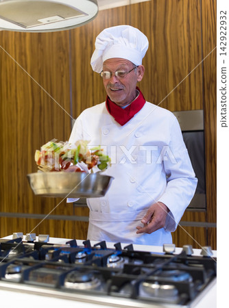 Middle Eastern chef preparing iftar dinner for family at a modern home during Eid Ramadan celebration Middle Eastern chef preparing iftar dinner for family at a modern home during Eid Ramadan celebration 142922932