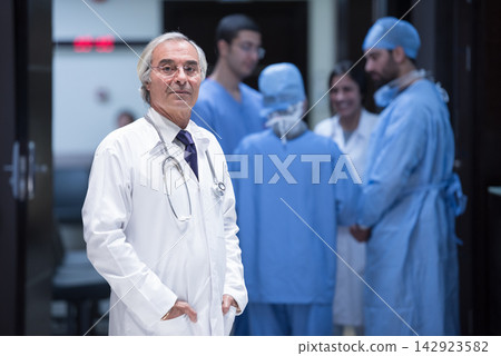 Senior doctor leading eye surgery team meeting in a modern Middle Eastern hospital clinic in Egypt Senior doctor leading eye surgery team meeting in a modern Middle Eastern hospital clinic in Egypt 142923582