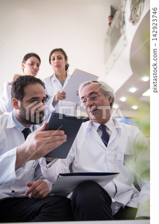 Middle Eastern eye hospital doctors team meeting in a modern ophthalmology clinic in Egypt 142923746