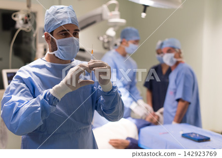 Eye surgery team in a modern Middle Eastern hospital clinic in Egypt preparing for operation Eye surgery team in a modern Middle Eastern hospital clinic in Egypt preparing for operation 142923769